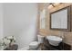 Chic powder room with a vessel sink, decorative mirror, and stylish fixtures at 12610 Eagles Entry Dr, Odessa, FL 33556