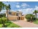 Stunning two-story home with a brick driveway, lush landscaping, and a warm, inviting facade at 12610 Eagles Entry Dr, Odessa, FL 33556