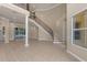 A spacious foyer with tile floors, a staircase, and an open floorplan at 12610 Eagles Entry Dr, Odessa, FL 33556