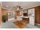 This home office features built-in bookshelves, a ceiling fan, and neutral colors at 12610 Eagles Entry Dr, Odessa, FL 33556
