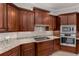 Elegant kitchen featuring granite countertops, stainless steel appliances, and custom cabinetry at 12610 Eagles Entry Dr, Odessa, FL 33556