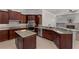 Stylish kitchen with granite countertops, stainless steel appliances, and a center island at 12610 Eagles Entry Dr, Odessa, FL 33556
