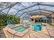 Inviting screened pool and spa area, perfect for outdoor entertaining and relaxation at 12610 Eagles Entry Dr, Odessa, FL 33556