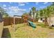Grassy backyard with playset, perfect for children at 130 41St Ne Ave, St Petersburg, FL 33703