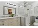 Modern bathroom featuring double vanity, glass shower, and updated fixtures at 130 41St Ne Ave, St Petersburg, FL 33703