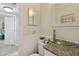 Small bathroom features a vessel sink, granite countertop, and wainscoting at 130 41St Ne Ave, St Petersburg, FL 33703