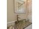 Updated bathroom with modern vanity, glass bowl sink, and stainless faucet at 130 41St Ne Ave, St Petersburg, FL 33703