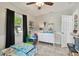 Bright bedroom with playful decor, ceiling fan, and a sunny window at 130 41St Ne Ave, St Petersburg, FL 33703