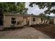 Charming single-story home featuring a well-manicured front yard with lush landscaping and a welcoming front door at 130 41St Ne Ave, St Petersburg, FL 33703