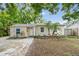 Charming single-story home with a well-manicured front yard, lush landscaping, and a freshly painted exterior at 130 41St Ne Ave, St Petersburg, FL 33703