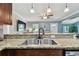 Kitchen sink featuring granite counters, stainless steel sink and sleek faucet at 130 41St Ne Ave, St Petersburg, FL 33703