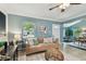 Inviting living room featuring a comfortable couch, stylish decor, and plenty of natural light at 130 41St Ne Ave, St Petersburg, FL 33703