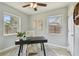 Bright office features natural light, a ceiling fan, and neutral tones at 130 41St Ne Ave, St Petersburg, FL 33703
