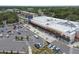 A commercial aerial shot shows the Whole Foods Market, parking lot, and palm trees at 130 41St Ne Ave, St Petersburg, FL 33703