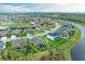Breathtaking aerial view of the home nestled in a picturesque community with serene water views at 13034 Bliss Loop, Bradenton, FL 34211