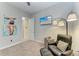 Bedroom featuring an entertainment area with TV and comfortable seating at 13034 Bliss Loop, Bradenton, FL 34211