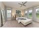 Bright bedroom with ample natural light, plush carpeting, and stylish decor at 13034 Bliss Loop, Bradenton, FL 34211