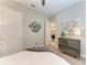Bedroom with artwork and a view into the hallway and another room at 13034 Bliss Loop, Bradenton, FL 34211