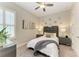 Cozy bedroom featuring a ceiling fan, modern decor, and comfortable furnishings at 13034 Bliss Loop, Bradenton, FL 34211