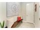 Inviting entryway with a wooden bench, decorative pillows, and artwork at 13034 Bliss Loop, Bradenton, FL 34211
