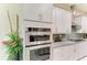 Modern kitchen features stainless steel appliances, granite countertops, and stylish backsplash at 13034 Bliss Loop, Bradenton, FL 34211