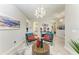 Spacious living room with designer lighting, contemporary art, and comfortable seating at 13034 Bliss Loop, Bradenton, FL 34211