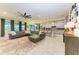 Open-concept living area with modern furnishings, an island, and a gourmet kitchen at 13034 Bliss Loop, Bradenton, FL 34211
