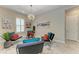 Stylish living room with modern furnishings, bright lighting, and elegant window shutters at 13034 Bliss Loop, Bradenton, FL 34211