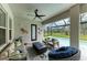 Relaxing screened-in patio featuring cozy seating, a stylish fire pit, and tranquil views of the pool area at 13034 Bliss Loop, Bradenton, FL 34211