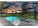 Inviting screened-in pool and spa with a peaceful view of nature, perfect for relaxing at 13034 Bliss Loop, Bradenton, FL 34211