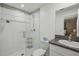 A bright bathroom with white cabinets and a glass shower at 14413 Seattle Slew Ln, Ruskin, FL 33573