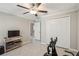 Bedroom with a ceiling fan, double closet, and an exercise bike at 14413 Seattle Slew Ln, Ruskin, FL 33573