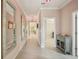 Long hallway with tile flooring and mirrors at 14413 Seattle Slew Ln, Ruskin, FL 33573