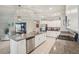 Spacious kitchen with granite countertops, a large island, and stainless steel appliances at 14413 Seattle Slew Ln, Ruskin, FL 33573