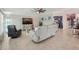Comfortable living area features a large TV, decorative cabinet, and plush seating at 14413 Seattle Slew Ln, Ruskin, FL 33573