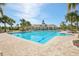 Beautiful pool featuring sun loungers and a shaded pavilion for residents at 14413 Seattle Slew Ln, Ruskin, FL 33573