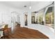 Bright dining area boasts wood floors and a bay window with views of the lanai at 15045 Wind Whisper Dr, Odessa, FL 33556
