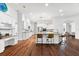 Bright kitchen with granite countertops, an island with bar seating, stainless steel appliances, and white cabinets at 15045 Wind Whisper Dr, Odessa, FL 33556