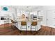 Gourmet kitchen features a large island with seating, granite countertops, and stainless steel appliances at 15045 Wind Whisper Dr, Odessa, FL 33556