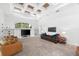Large living room featuring coffered ceilings, built-in shelving, large windows, and comfortable seating at 15045 Wind Whisper Dr, Odessa, FL 33556
