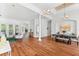 Open floor plan connecting living spaces, with hardwood floors and elegant architectural details at 15045 Wind Whisper Dr, Odessa, FL 33556