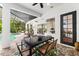 Covered outdoor dining area offering views of the pool and well-manicured backyard at 15045 Wind Whisper Dr, Odessa, FL 33556