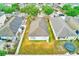 Aerial view of a house with a large yard featuring a trampoline and patio at 15410 Quail Woods Pl, Ruskin, FL 33573