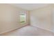 Simple bedroom with carpet, window, and closet at 15410 Quail Woods Pl, Ruskin, FL 33573