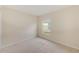 Bright bedroom with carpet, window, and neutral paint provides a comfortable space at 15410 Quail Woods Pl, Ruskin, FL 33573