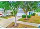 Charming single-Gathering home with a well-maintained front yard and mature trees at 15410 Quail Woods Pl, Ruskin, FL 33573