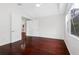 Spacious bedroom featuring vaulted ceilings, hard wood floors, and large windows at 16522 Ivy Lake Dr, Odessa, FL 33556