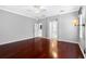 Large bedroom with hardwood floors, ceiling fan, ensuite bath, and ample closet space at 16522 Ivy Lake Dr, Odessa, FL 33556