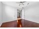 Large bedroom featuring hardwood floors, vaulted ceilings, and natural light at 16522 Ivy Lake Dr, Odessa, FL 33556