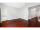 Spacious bedroom featuring hardwood flooring and easy access to the ensuite bathroom at 16522 Ivy Lake Dr, Odessa, FL 33556